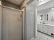 Bathroom with a glass-enclosed shower and a white vanity with a large mirror at 803 7Th Ne St, Fort Meade, FL 33841