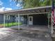 Covered carport with concrete flooring providing ample parking and outdoor space at 803 7Th Ne St, Fort Meade, FL 33841