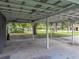 Spacious carport area with ample room for parking and storage, and easy access to the yard at 803 7Th Ne St, Fort Meade, FL 33841