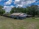 Low aerial view of the house with a well-maintained lawn and privacy fence at 803 7Th Ne St, Fort Meade, FL 33841