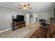 Spacious living room featuring sleek flooring, a modern TV setup, and comfortable seating at 803 7Th Ne St, Fort Meade, FL 33841
