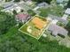 Aerial view highlighting the property's location within a serene, tree-filled neighborhood at 808 Ware Ne Ave, Winter Haven, FL 33881