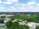 Aerial view showing a residential area, highlighting available properties, roadways, and surrounding lush greenery at 808 Ware Ne Ave, Winter Haven, FL 33881