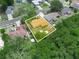 Aerial view displaying the home's backyard, shed, and its setting in a residential neighborhood at 808 Ware Ne Ave, Winter Haven, FL 33881