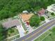 Aerial view illustrating the property with ample parking and surrounding verdant landscape at 808 Ware Ne Ave, Winter Haven, FL 33881