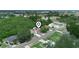 Aerial view showing the property surrounded by lush greenery and neighborhood streets at 808 Ware Ne Ave, Winter Haven, FL 33881