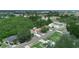 Overhead angle of a community showcasing available real estate in proximity to roadways and nearby bodies of water at 808 Ware Ne Ave, Winter Haven, FL 33881