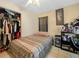 Bedroom featuring tiled floor, open closet, and a ceiling fan at 808 Ware Ne Ave, Winter Haven, FL 33881