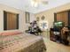 Cozy bedroom with tiled floor, ceiling fan, and ample storage space at 808 Ware Ne Ave, Winter Haven, FL 33881