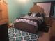 Bedroom with an ornate wooden frame bed and matching dresser at 808 Ware Ne Ave, Winter Haven, FL 33881