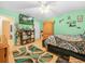 Bedroom featuring a large bed, decorative rug, and a ceiling fan at 808 Ware Ne Ave, Winter Haven, FL 33881