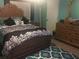 Bedroom with an ornate wooden frame bed and matching dresser at 808 Ware Ne Ave, Winter Haven, FL 33881