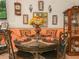 Charming dining room with a round table and decorative wall art, creating a cozy atmosphere at 808 Ware Ne Ave, Winter Haven, FL 33881