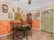 Inviting dining area featuring neutral tile floors, a round table with seating for four, and bright lighting at 808 Ware Ne Ave, Winter Haven, FL 33881