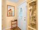 Welcoming entryway with a decorative mirror, shoe rack and an ornate display cabinet at 808 Ware Ne Ave, Winter Haven, FL 33881