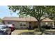 Charming single-story home featuring manicured lawn, mature trees, and well-maintained landscaping at 808 Ware Ne Ave, Winter Haven, FL 33881