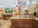 Open kitchen featuring granite countertops, pot rack, and stainless steel sink at 808 Ware Ne Ave, Winter Haven, FL 33881