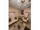 Elegantly decorated living room with opulent furniture, decorative accents, and stylish chandelier at 808 Ware Ne Ave, Winter Haven, FL 33881