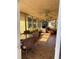 Inviting sunroom with tile flooring, ceiling fans and comfortable seating at 808 Ware Ne Ave, Winter Haven, FL 33881