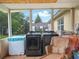 View of a sunroom, showcasing washer and dryer hookups and outdoor views at 808 Ware Ne Ave, Winter Haven, FL 33881