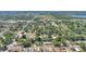 Aerial view of the property's location within a lush, tree-lined neighborhood with nearby lake at 825 Augusta St, Lakeland, FL 33805
