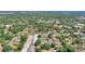 Aerial neighborhood view of the property with commercial building and houses at 825 Augusta St, Lakeland, FL 33805