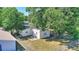 A peaceful backyard featuring mature trees with a full fence that surrounds the property at 825 Augusta St, Lakeland, FL 33805
