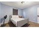 Serene bedroom with neutral tones, featuring a full-size bed and a minimalist aesthetic at 825 Augusta St, Lakeland, FL 33805