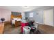 Bedroom with light blue and pink walls, a wooden bed, and storage boxes on carpet at 825 Augusta St, Lakeland, FL 33805
