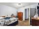 Bedroom with pale walls and light, with a dark wood dresser visible next to a bed at 825 Augusta St, Lakeland, FL 33805