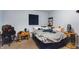 Casual bedroom with a full bed, desk, and a relaxed, lived-in atmosphere at 825 Augusta St, Lakeland, FL 33805