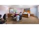 Bedroom with wooden furniture and a bed, along with items stacked in the room at 825 Augusta St, Lakeland, FL 33805