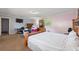 A large bedroom has a desk, tv, and bed, with mixed pink and blue walls at 825 Augusta St, Lakeland, FL 33805