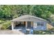 Cozy single story home featuring a carport and a well-maintained front yard at 825 Augusta St, Lakeland, FL 33805
