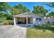 Charming single-story home featuring a convenient carport and ample parking at 825 Augusta St, Lakeland, FL 33805