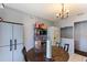 Bright kitchen with white appliances and a small dining area, perfect for casual meals at 825 Augusta St, Lakeland, FL 33805