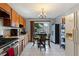 Functional kitchen with ample cabinet space, stainless steel stove, small table set and white appliances at 825 Augusta St, Lakeland, FL 33805