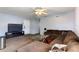 Cozy living room with comfortable sectional sofa and a ceiling fan for added comfort at 825 Augusta St, Lakeland, FL 33805