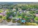 Beautiful aerial view of lakefront homes with private docks and lush, green surroundings at 9950 W Lake Marion Rd, Haines City, FL 33844
