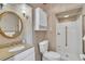 Bathroom with a vanity, toilet, and a shower with neutral tile at 9950 W Lake Marion Rd, Haines City, FL 33844