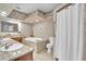 Bathroom features a soaking tub, walk-in shower, and dual sinks at 9950 W Lake Marion Rd, Haines City, FL 33844