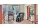 Comfortable seating area with a massage chair and a beautiful bay window view at 9950 W Lake Marion Rd, Haines City, FL 33844