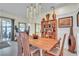 Dining area featuring modern lighting, open shelving, and views of the patio area at 9950 W Lake Marion Rd, Haines City, FL 33844