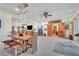 Well-lit dining area shows modern light fixtures, neutral walls, and a sliding barn door at 9950 W Lake Marion Rd, Haines City, FL 33844