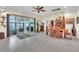 Bright dining room features a ceiling fan, unique decor, and sliding glass doors to the patio at 9950 W Lake Marion Rd, Haines City, FL 33844