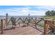 Relaxing dock view with Adirondack chairs overlooking the serene water, perfect for enjoying peaceful moments at 9950 W Lake Marion Rd, Haines City, FL 33844