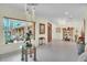 Elegant foyer with modern lighting, tile floors, and ample natural light streaming through a large window at 9950 W Lake Marion Rd, Haines City, FL 33844