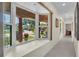 Inviting hallway with a large bay window overlooking the lush front yard at 9950 W Lake Marion Rd, Haines City, FL 33844
