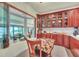 Well-lit kitchen with wooden cabinetry and a large bay window overlooking greenery at 9950 W Lake Marion Rd, Haines City, FL 33844