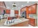 Spacious kitchen with custom cabinetry, granite countertops, and stainless steel appliances at 9950 W Lake Marion Rd, Haines City, FL 33844